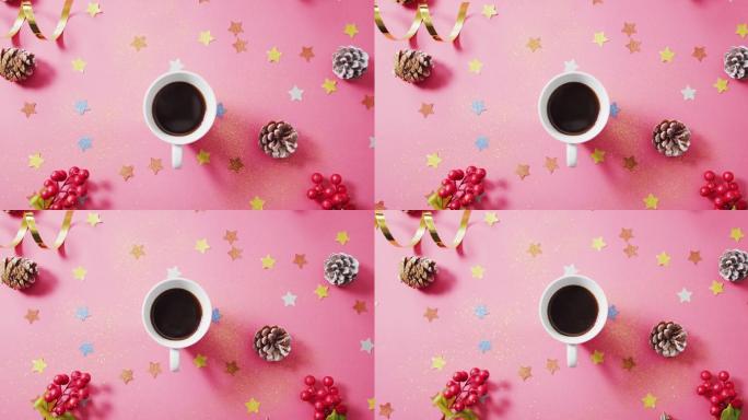 咖啡，红色浆果，星星和松果在粉红色背景的视频