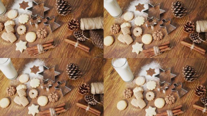 圣诞装饰的视频与各种各样的饼干和牛奶在木制背景
