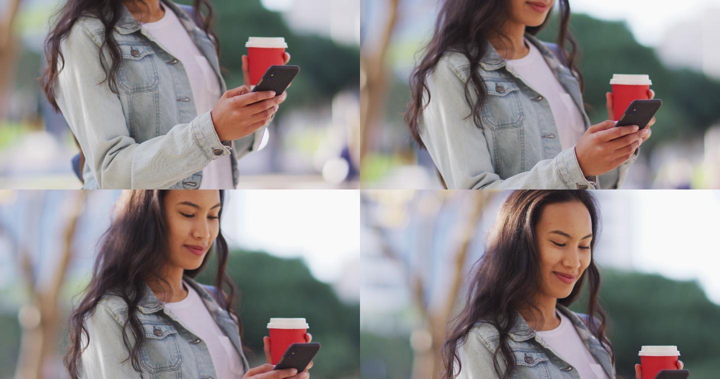 亚洲女性用智能手机端着外卖咖啡