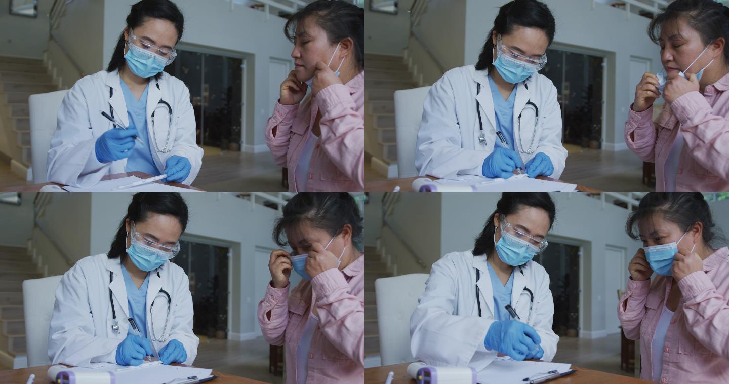 亚洲女护士在诊治女病人时戴口罩和手套