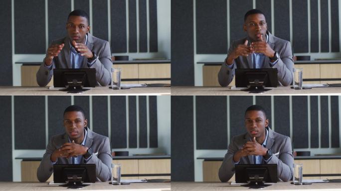 非裔美国商人在现代办公室的会议室进行视频通话
