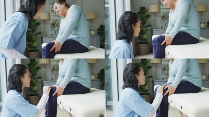 亚洲女性理疗师检查女性患者在手术时抱膝疼痛