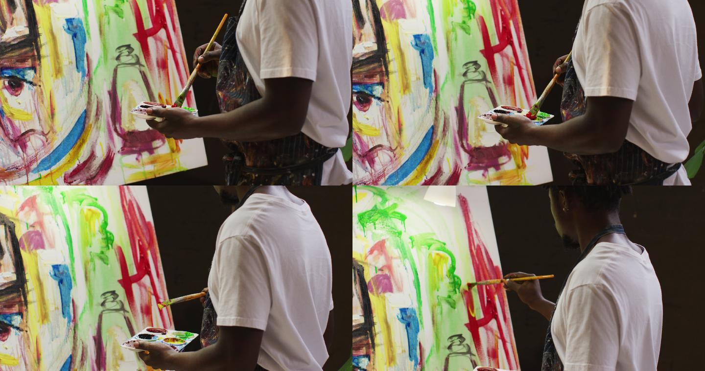 非裔美国男性艺术家在艺术工作室用智能手机拍他的画