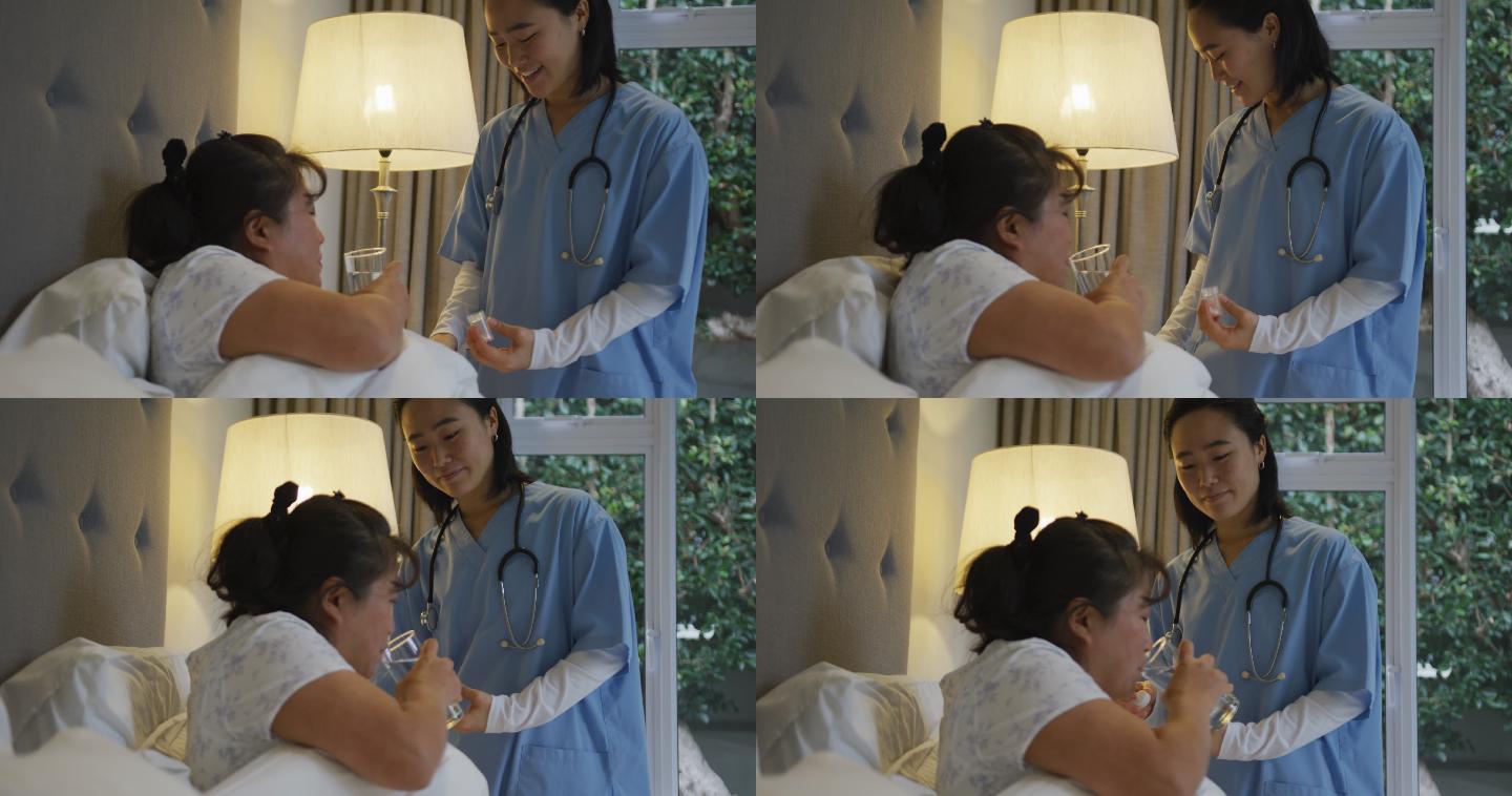 微笑的亚洲女医生帮助女病人在床上吃药