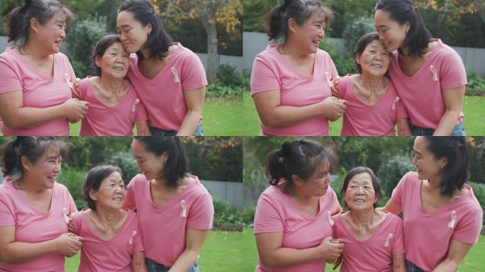 快乐的亚洲成年孙女，母亲和祖母，在花园里散步和拥抱