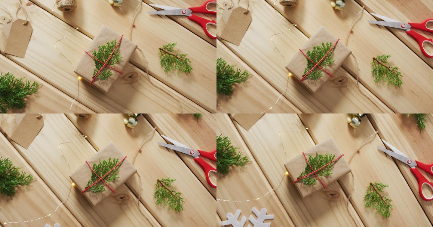 木制背景上的圣诞装饰与礼物和剪刀的视频