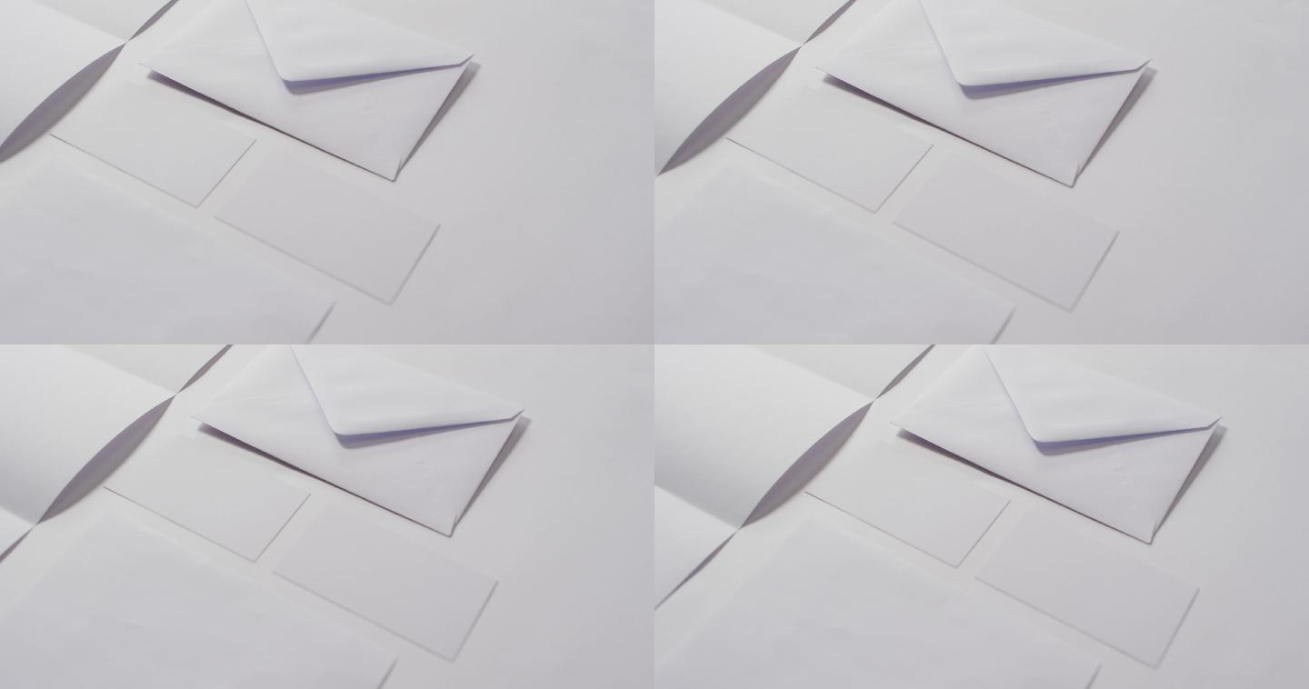 视频的信封和白色卡片与复制空间在白色背景