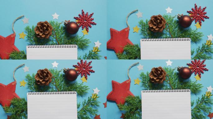 圣诞节的装饰与笔记本和复制空间在蓝色背景的视频
