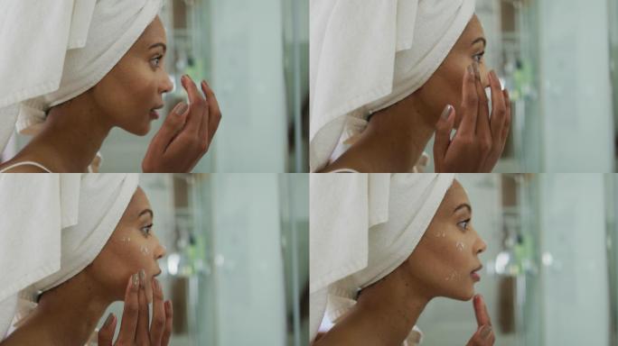 混血儿妇女头戴毛巾，在脸上涂奶油