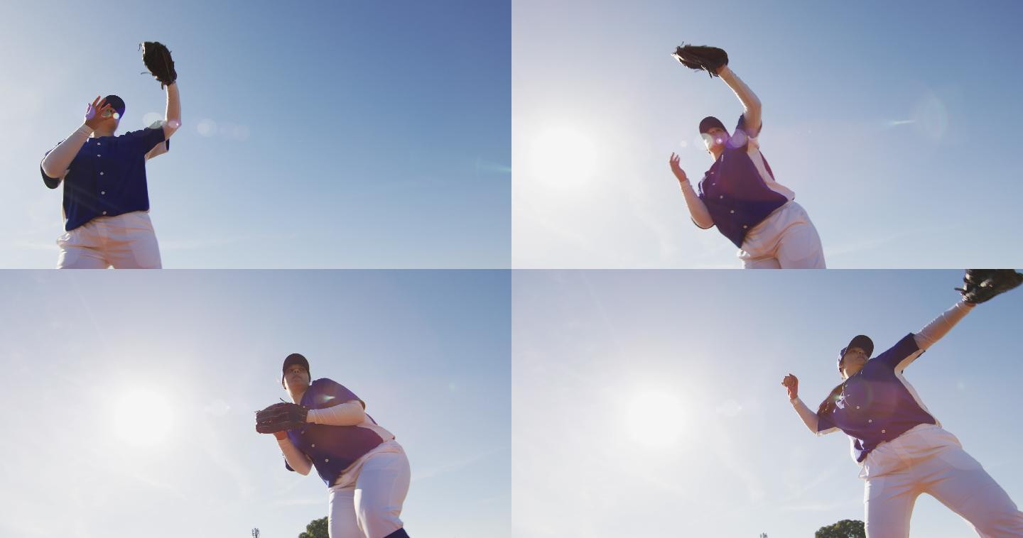 在阳光明媚的棒球场上，女棒球手接球和投球