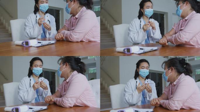 亚洲女护士戴着口罩在医院为女性患者接种新冠疫苗