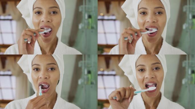 混血儿妇女刷牙的肖像