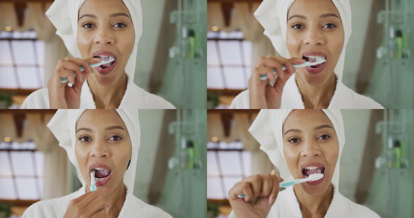 混血儿妇女刷牙的肖像