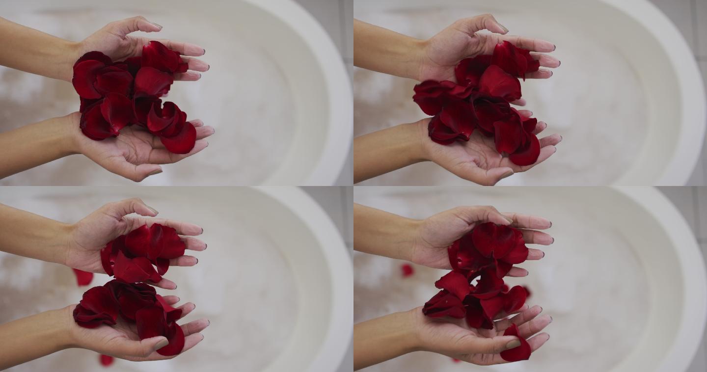 混血儿妇女正在用玫瑰花瓣洗澡