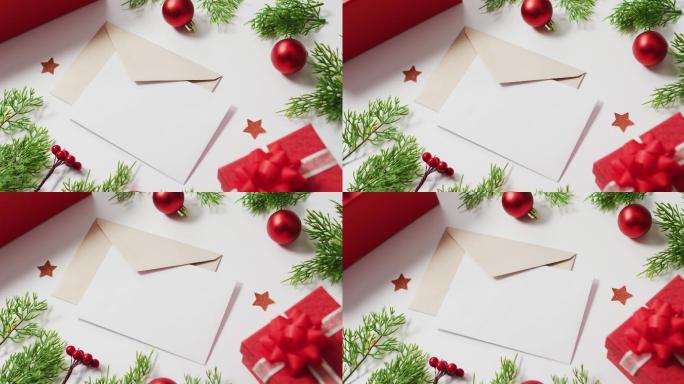 红色圣诞装饰的视频，白色背景上的信封