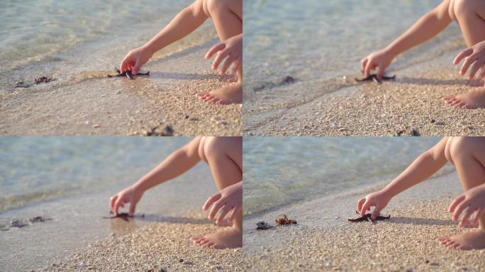 唯美海边小孩小手抓海星