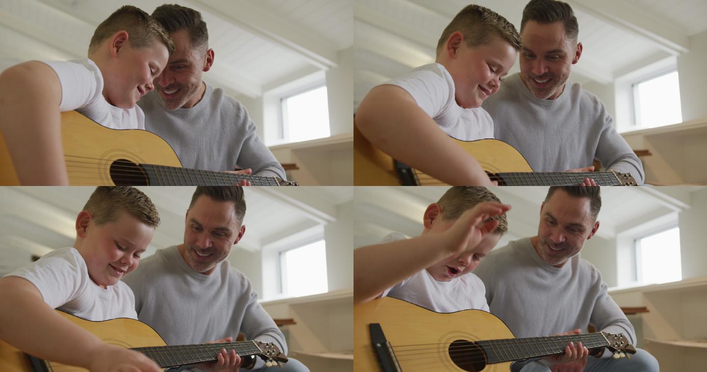 一个面带微笑的白人父亲和儿子一起坐在客厅里弹吉他