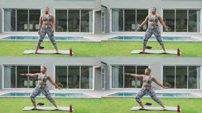 快乐的非裔美国胖女人在练瑜伽，站在花园里伸展身体