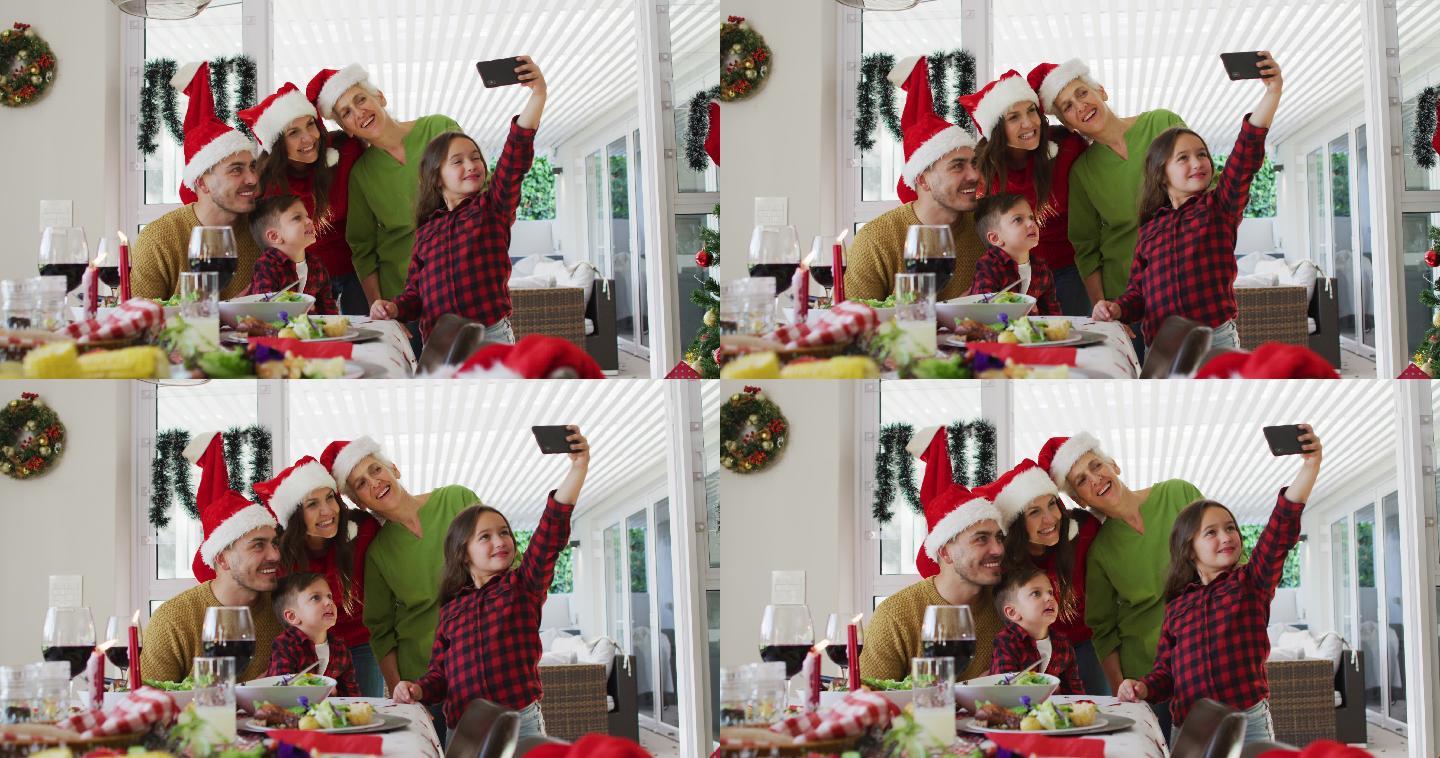 快乐的白种人多代家庭戴着圣诞帽自拍