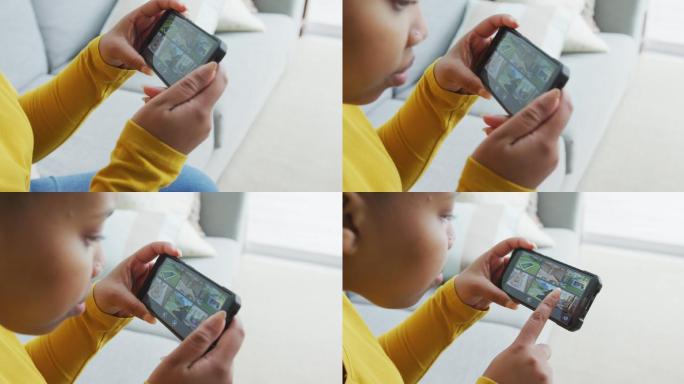 快乐的非裔美国胖女人坐在沙发上，在客厅用智能手机