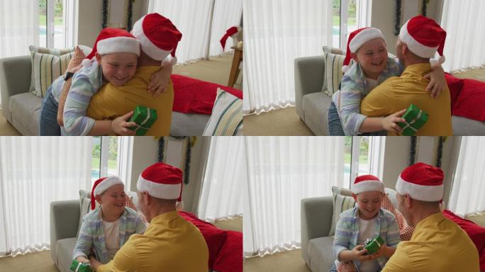 白人男孩戴着圣诞老人的帽子，抱着他的父亲在家里