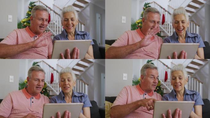 快乐的白种人老夫妇在圣诞节视频通话
