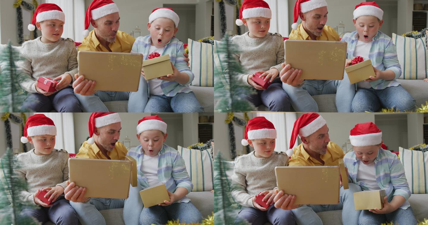 圣诞节期间，一位白人父亲和两个儿子用数码平板电脑视频通话，打开礼物
