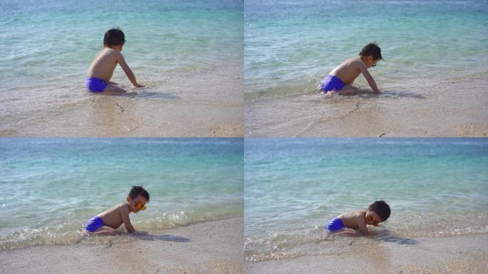 小男孩海边玩水
