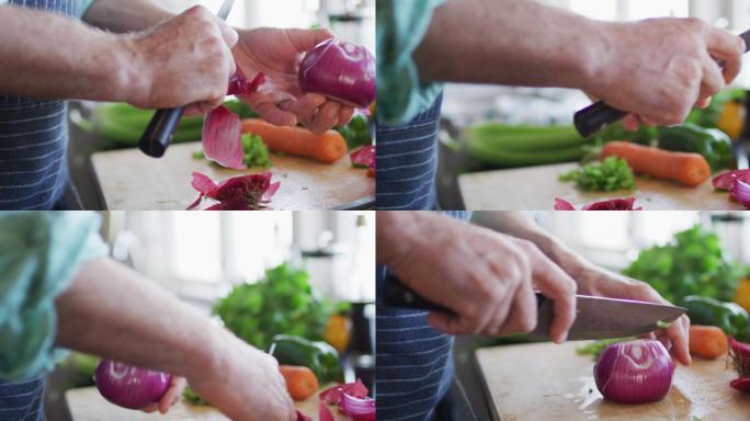 男子的手在切菜板上切红洋葱的特写