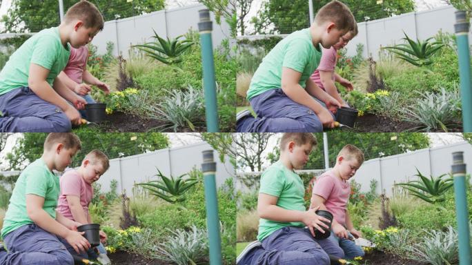 快乐的白人男孩和他的兄弟在花园里一起园艺