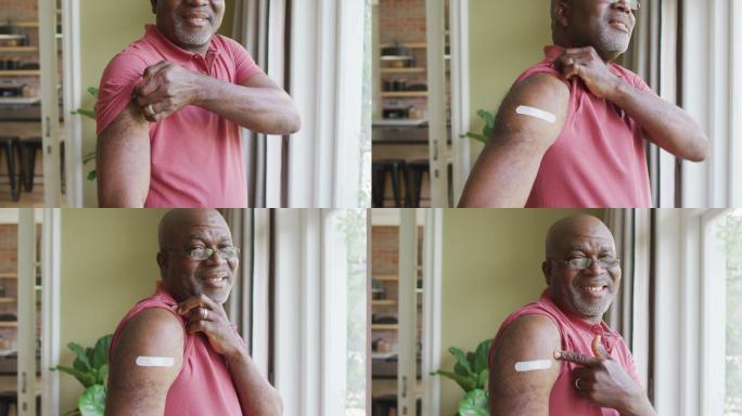非裔美国人老人的肖像显示他接种了疫苗的肩膀在家里