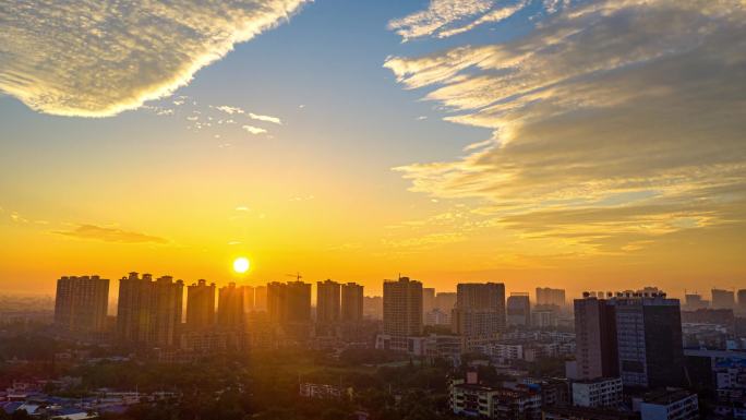 城市朝霞满天延时、夜晚街灯开放过程