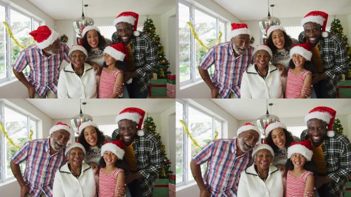 快乐的非裔美国人多代家庭戴着圣诞帽，拍摄节日照片