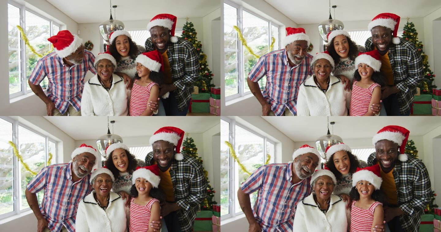 快乐的非裔美国人多代家庭戴着圣诞帽，拍摄节日照片