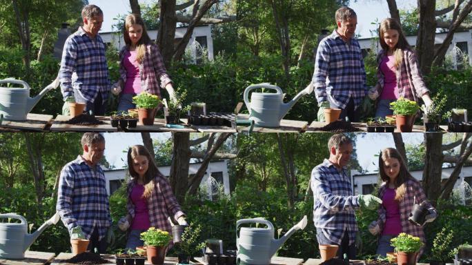 微笑的白人父亲和十几岁的女儿在花园里工作和检查植物