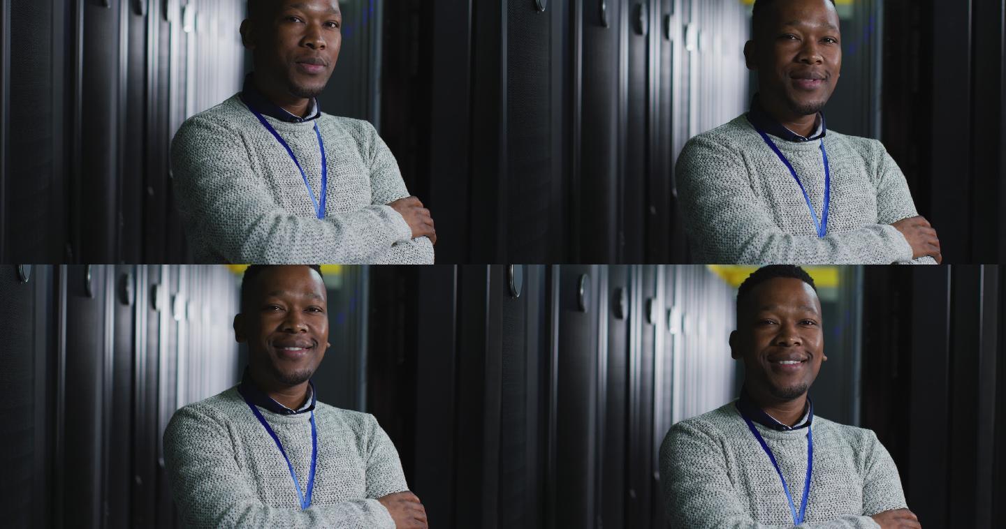 非裔美国男性计算机技术人员与安全通行证在业务服务器室