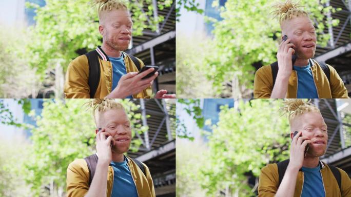 一个留着长发绺的白化非裔美国人在公园里用智能手机聊天