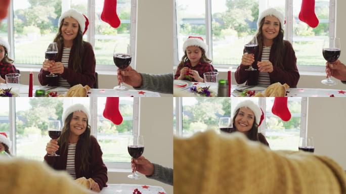 幸福的白种人多代家庭戴着圣诞帽，吃着圣诞大餐，烤着吐司