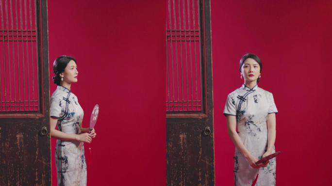 穿旗袍的年轻女子中国美女走出素材