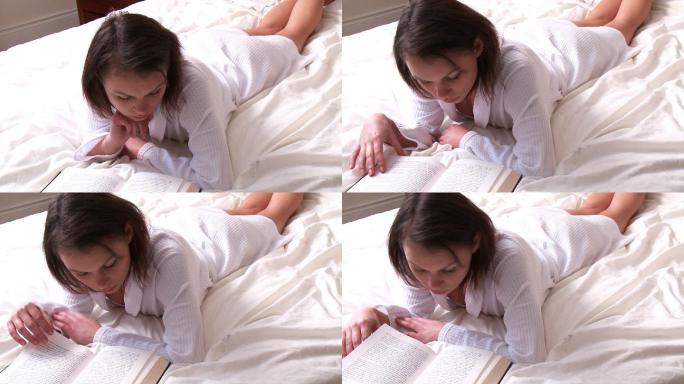 女人在床上看书特写