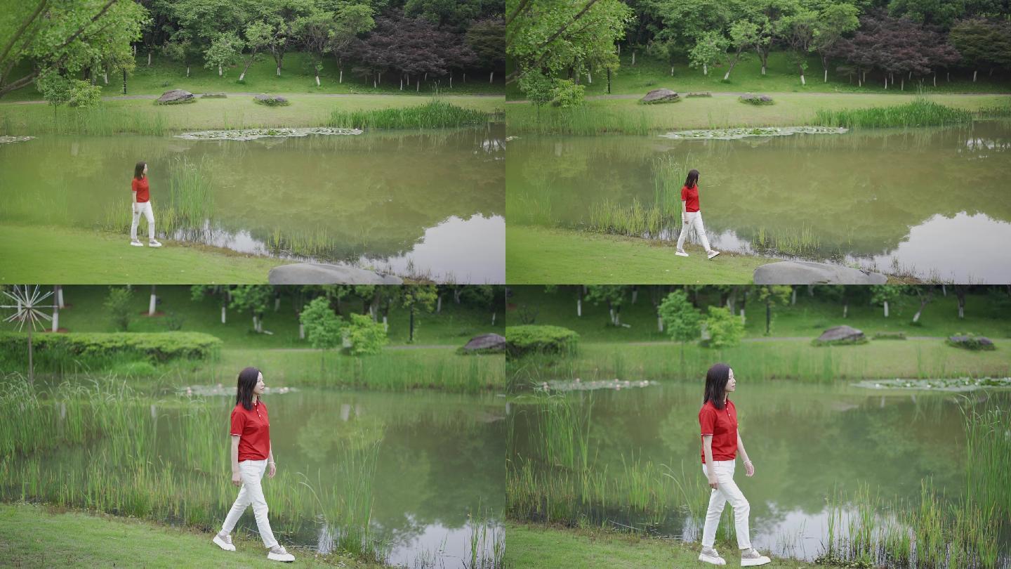 池塘边悠闲散步的女孩美女
