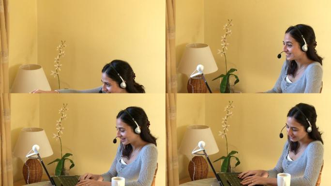 女人戴着耳机用电脑特写