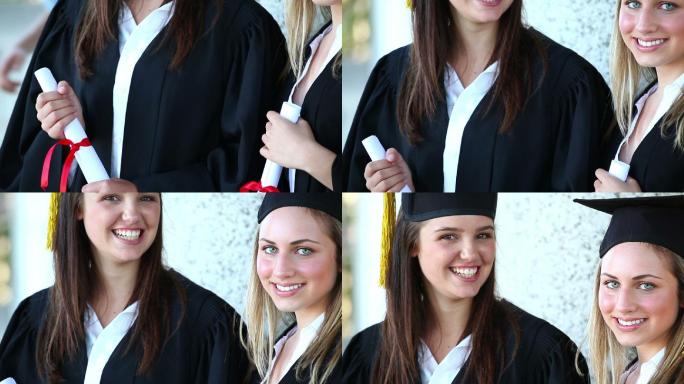 同学们微笑着拿着毕业证书站在学校前