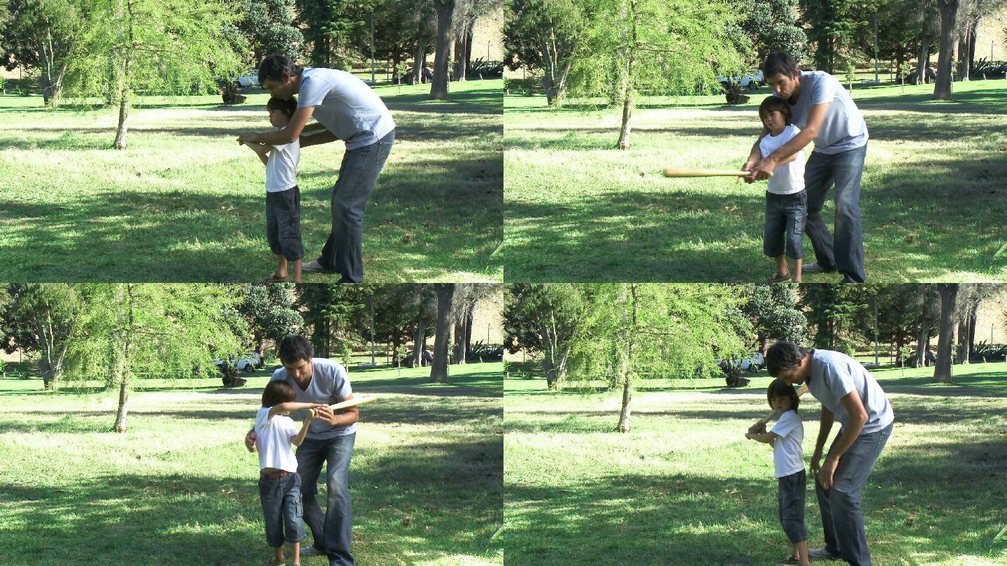 父亲在公园教儿子打棒球特写