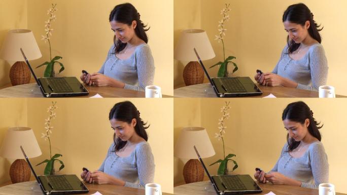 女人坐在电脑前发短信特写