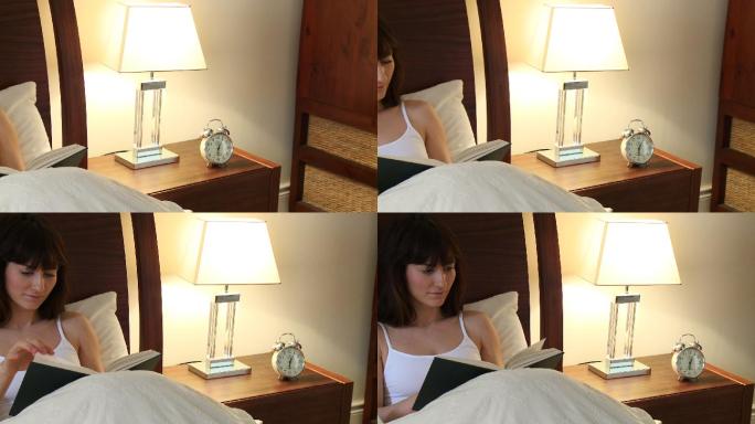 女人躺在床上看书特写