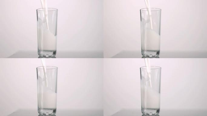牛奶倒入玻璃杯慢动作，在灰色背景下