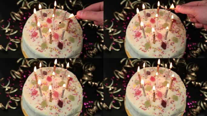 手点燃蜡烛在生日蛋糕上方拍摄