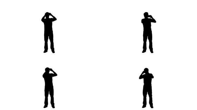 一个男人的剪影通过双筒望远镜在一个白色的背景