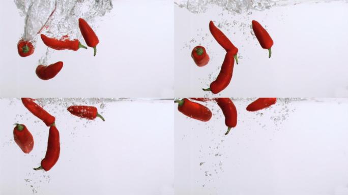 红色辣椒水中落下慢镜头，在白色背景下